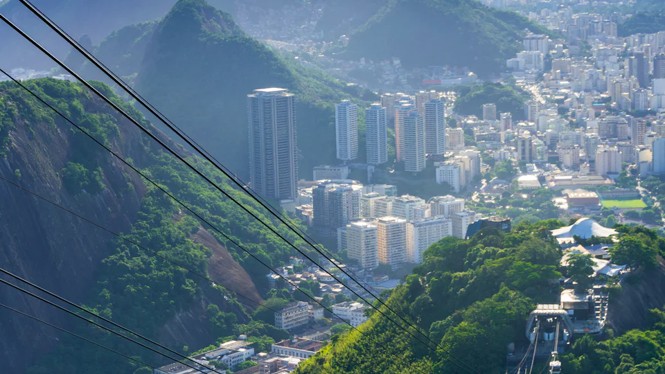 Sugarloaf Mountain cable car silhouetted at sunset over Rio de Janeiro